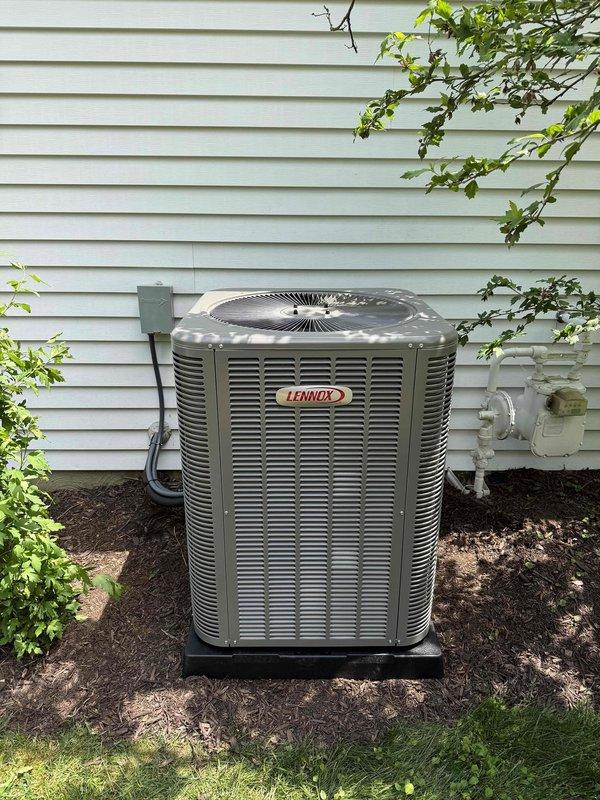 # HVAC Complete System Installation

Completed full installation of 80% AFUE downflow gas furnace with hot water heater and matching Lennox air conditioning system. Installed outdoor condenser unit on equipment pad with proper clearances from structure and landscaping. Ran electrical conduit from wall-mounted disconnect box to condensing unit per code requirements. Established condensate drainage using PVC piping routed along exterior wall. Verified all electrical connections, refrigerant lines, and system controls for proper operation. Additionally installed customer-supplied shower head as requested. System tested and confirmed operational within manufacturer specifications.