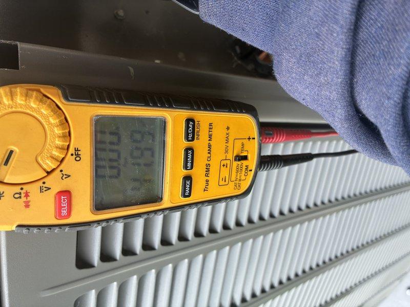 Completed scheduled preventive maintenance cooling visit on residential Lennox HVAC system. Performed comprehensive system inspection including electrical measurements using digital multimeter to verify proper voltage and amperage at heating elements and outdoor condensing unit. Inspected outdoor unit positioned on concrete pad, confirmed proper airflow through cabinet louvers, verified secure mounting and level installation. Checked electrical connections, PVC condensate line, and conduit installations at exterior wall penetrations. System operating within normal parameters with no deficiencies noted.