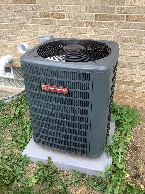 Conducted on-site evaluation for residential HVAC system experiencing no cooling condition. Assessed existing Crown Group outdoor condensing unit and indoor furnace system located in basement utility area. Documented current equipment configuration including PVC condensate drainage, refrigerant line sets, and electrical connections. Provided comprehensive replacement estimate for complete system upgrade to address cooling failure and equipment age concerns.