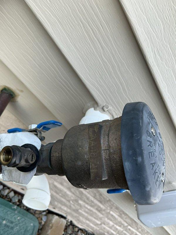 Completed annual backflow preventer testing and inspection on exterior pressure vacuum breaker assembly. Device tested within acceptable parameters, all test valves operated properly, and customer was provided with required certification paperwork for municipal compliance records.