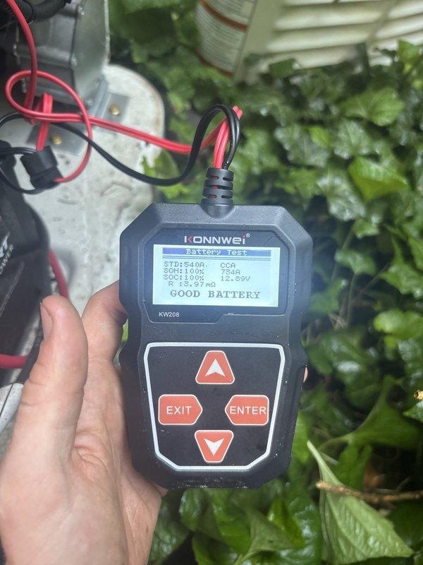 Performed scheduled maintenance on 12kW standby generator unit. Conducted comprehensive battery load test using digital analyzer, confirming battery health at 100% state of health with 754 CCA, 12.89V state of charge, and 6.97mΩ internal resistance - all readings within manufacturer specifications indicating good battery condition. Visually inspected generator enclosure, ventilation louvers, and associated electrical connections for proper operation and clearance from surrounding vegetation.
