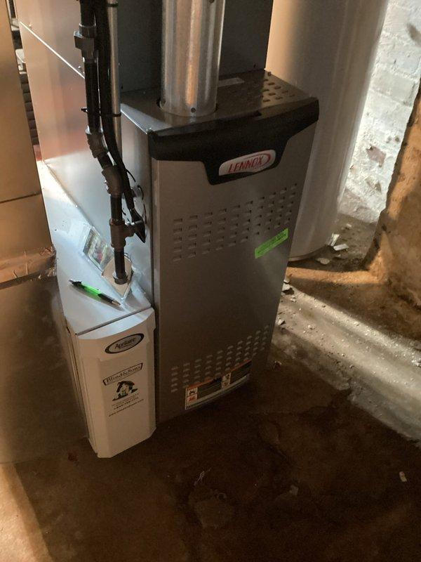 Completed MVP cooling maintenance visit on 4-year-old Lennox system. Performed comprehensive inspection of outdoor condensing unit, examining electrical components including capacitor, wiring connections, and terminal blocks. Inspected indoor furnace unit and associated ductwork in basement. All components found operating within normal parameters. Documented system condition with photos for maintenance records.