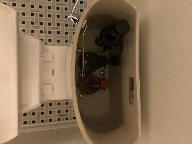 Rebuilt flapper assembly and replaced tank lever on American Standard Heritage toilet in first floor powder room. Special order handle was procured and installed to restore proper flush operation. Work completed upon parts arrival at shop.