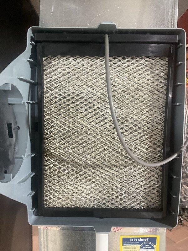 Completed scheduled MVP cooling maintenance visit on 6-year-old HVAC system. Inspected and documented air filter condition, which showed normal dust accumulation consistent with regular use. Verified air return grille installation and accessibility for proper system airflow.