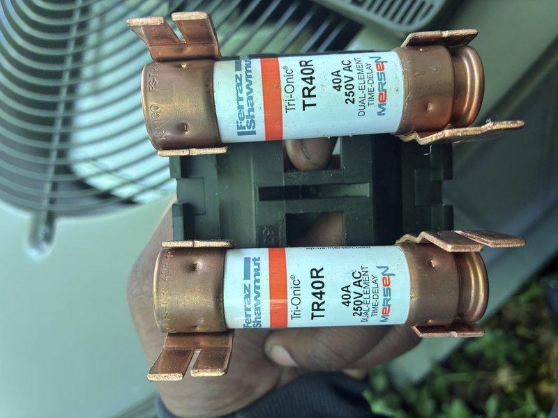 Completed routine preventive maintenance on 3-year-old air conditioning system. Inspected electrical components including dual-element time-delay fuses rated at 40A/250V AC in outdoor condensing unit, confirmed proper fuse operation and secure mounting. Measured system amperage draw of 67.32A using clamp meter to verify compressor and fan motor performance within manufacturer specifications. All components operating normally with no deficiencies noted.