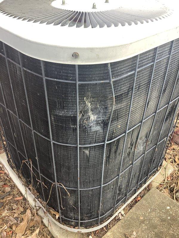 Responded to no-cooling call on approximately 20-year-old air conditioning system. Upon arrival, confirmed outdoor condenser unit was not operating. Performed diagnostic evaluation of both indoor air handler and outdoor condensing unit. Inspected evaporator coil assembly showing significant age-related deterioration, dust accumulation, and corrosion on metal components. Examined outdoor condenser unit which exhibited substantial weathering, debris accumulation around base, and visible grime on protective grille and coil surfaces. Verified electrical supply at breaker panel and traced power to equipment. System required comprehensive assessment due to advanced age and lack of recent maintenance, with multiple components showing end-of-service-life conditions.