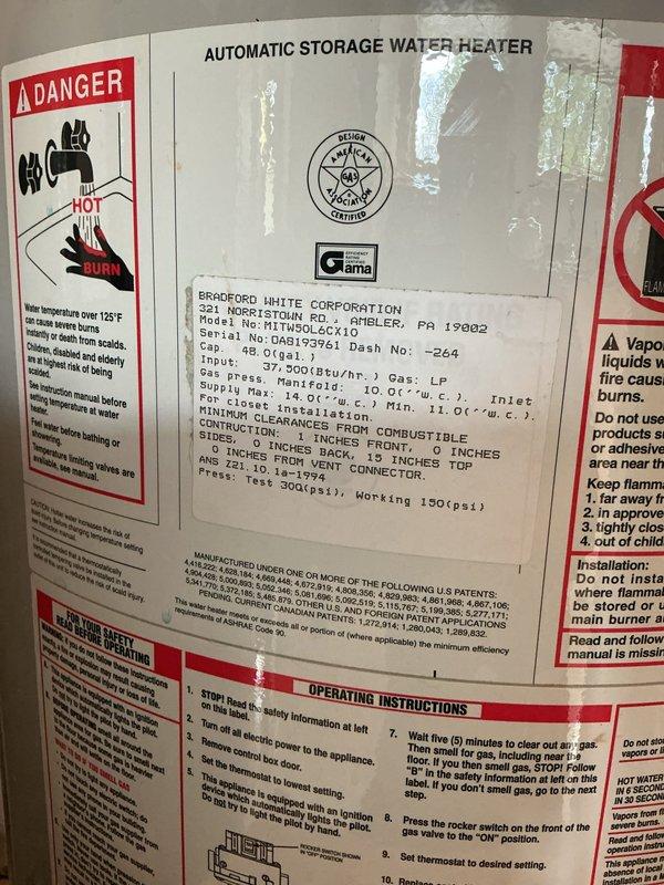 Responded to no hot water complaint on 26-year-old residential water heater. Upon arrival, performed diagnostic inspection of tanked water heater unit. Identified Bradford White 48-gallon automatic storage water heater (Serial #0WA1519761) that had reached end of service life and was no longer producing hot water. Documented existing equipment condition with photographs showing unit specifications, safety labels, and overall installation. Unit exhibited typical age-related failure consistent with expected lifespan for residential water heating equipment. Advised customer of findings and provided recommendations for replacement options.