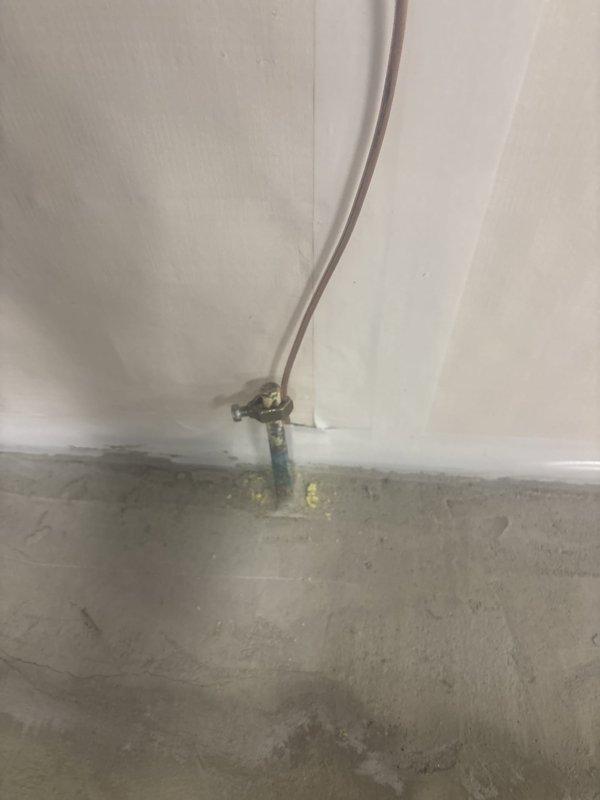 Responded to failed electrical inspection for grounding system deficiencies. Reconnected Ufer grounding electrode conductor to transfer switch, which serves as the first means of disconnect, per NEC 250.50 and 250.52(A)(3). Properly removed previously cut grounding electrode conductors from neutral bar that were creating potential for induced current, addressing NEC 110.12 workmanship requirements. All grounding connections properly terminated and system brought into code compliance for re-inspection.