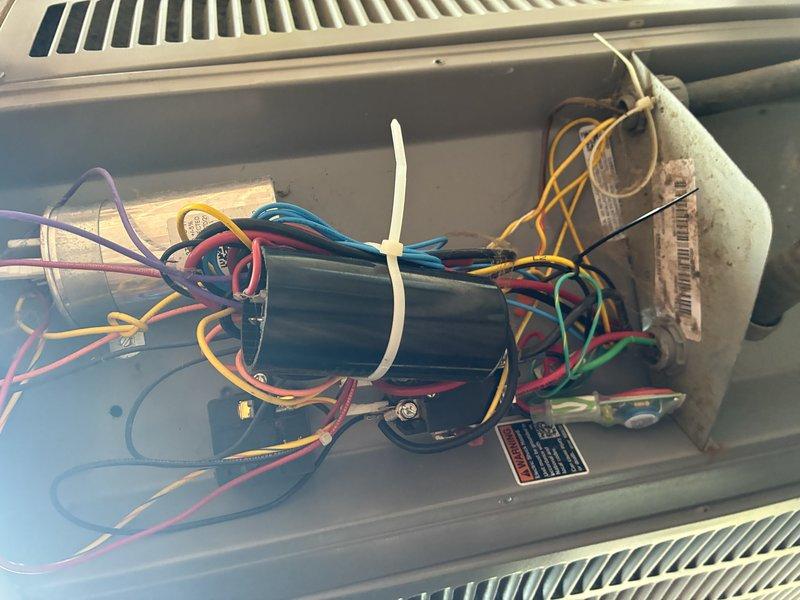 Completed preventive maintenance cooling visit on 3-year-old HVAC system. Inspected electrical components, capacitor, and wiring connections within the air handler cabinet, confirming all connections are secure and system is operating within normal parameters. Documented equipment condition with photos for service records.