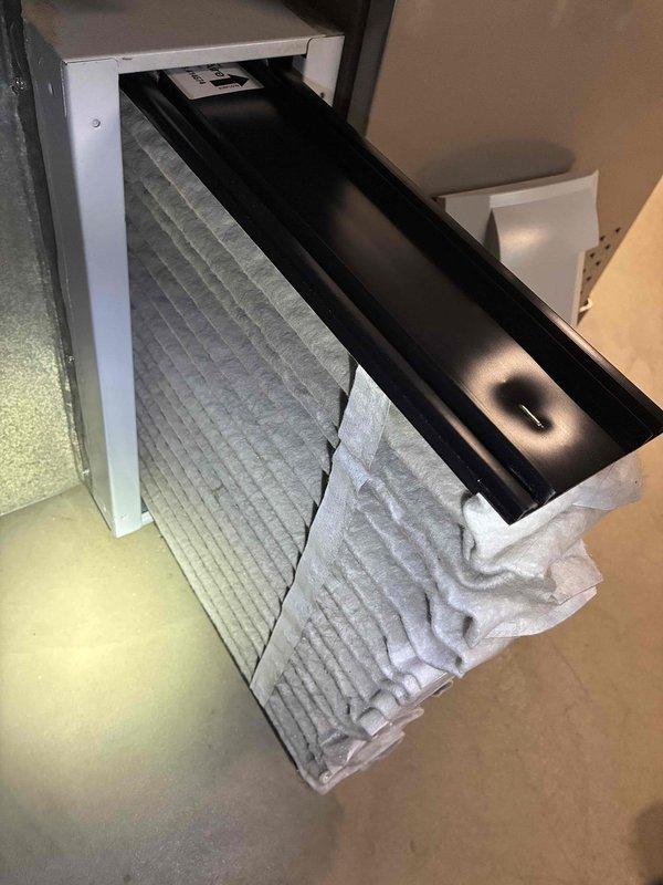 Completed scheduled cooling maintenance visit. Inspected and serviced HVAC system, including air filter examination which showed normal dust accumulation consistent with regular use. Verified system operation with temperature readings at 70.0°F, confirming proper functionality of the cooling equipment.