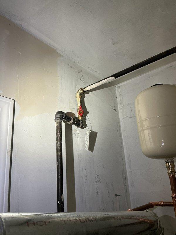 Replaced a failed 40-gallon tall gas water heater originally installed in 2010. The existing unit had a non-functioning pilot light due to a faulty gas control valve and pilot assembly. After evaluating repair versus replacement options, determined that replacement was the most cost-effective solution given the unit's age and expired warranty.

Removed the old water heater and installed a new Bradford White 40-gallon tall residential gas water heater with a 6-year manufacturer warranty. Performed all necessary code upgrades including installation of a new gas cock, expansion tank, and ball valve. Connected copper supply lines with soldered joints in proper configuration. Mounted expansion tank on wall above the water heater with appropriate piping connections. Installed flexible gas connector and verified all gas connections for proper operation and safety. Connected vent pipe to ensure proper exhaust ventilation from the unit.

Tested the new water heater for proper ignition, burner o