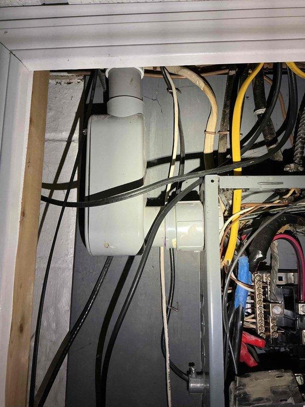 Responded to reported static and popping noise from electrical panel occurring when dryer was in operation. Upon inspection, identified 11-year-old panel with multiple circuit connections and wiring routing concerns. Investigated all breaker connections, tightened loose terminals, and verified proper wire seating in breaker connections. Tested panel under load with dryer running and confirmed elimination of audible noise. Panel now operating normally with no abnormal sounds detected.