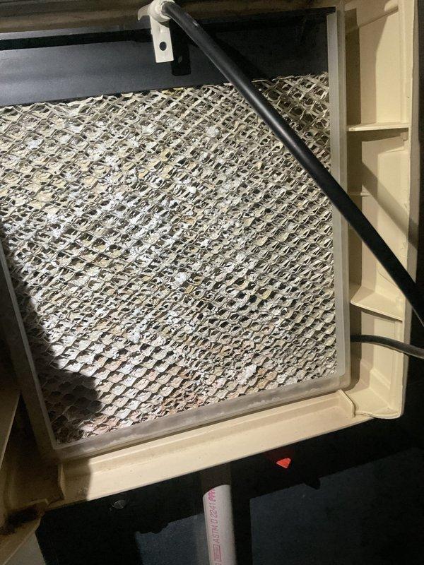 Completed comprehensive air conditioning tune-up on residential HVAC system, including thorough inspection of evaporator coil assembly which showed clean aluminum fins in good condition with intact honeycomb pattern and proper airflow clearance. Inspected air handler unit, verified proper operation of condensate drainage system, checked electrical connections and controls including wall-mounted APCO air purification system, and provided complimentary carbon monoxide detector for customer safety.