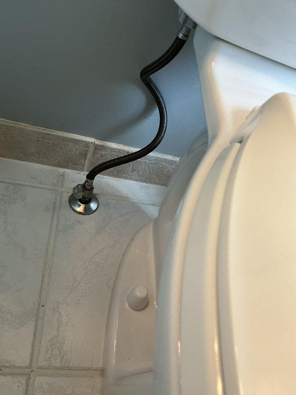 Successfully removed and replaced the existing toilet with a new American Standard Cadet Pro model. Installation included proper sealing of the wax ring, securing the fixture to the floor flange, and connecting a new braided stainless steel supply line with black protective covering to the chrome shut-off valve. Verified proper flush operation, checked for leaks at all connection points, and confirmed water supply functionality. The installation was completed in approximately three hours with all components functioning correctly.
