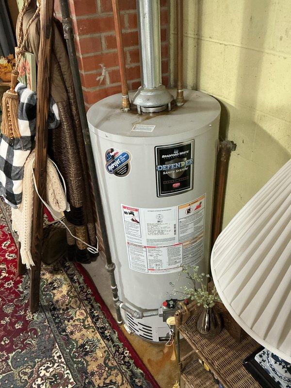 Responded to high-severity emergency call for backed-up basement drain with active flooding in 70-year-old home where visually impaired occupant faced safety hazards. Upon arrival, assessed basement conditions and documented water heater area showing no backup at that location, confirming flooding was isolated to drain system. Verified that existing water heater leak was unrelated to drain backup and subject of separate scheduled service appointment, allowing focus on resolving ground water drain obstruction and eliminating fall risk from standing water.