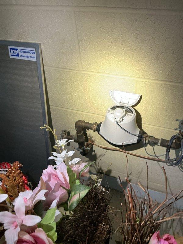 Responded to high-severity emergency call for backed-up basement drain with active flooding in 70-year-old home where visually impaired occupant faced safety hazards. Upon arrival, assessed basement conditions and documented water heater area showing no backup at that location, confirming flooding was isolated to drain system. Verified that existing water heater leak was unrelated to drain backup and subject of separate scheduled service appointment, allowing focus on resolving ground water drain obstruction and eliminating fall risk from standing water.