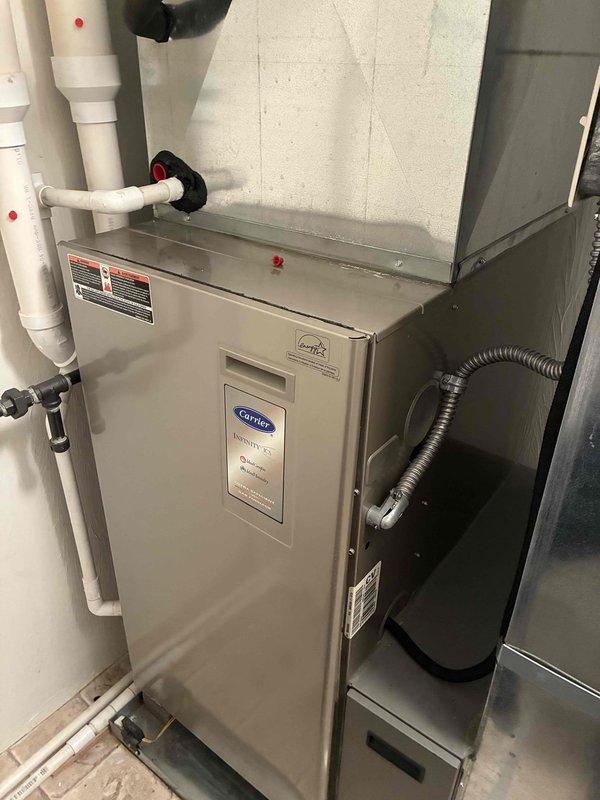 Completed MVP cooling maintenance visit on two HVAC systems. Performed comprehensive inspection of Carrier furnace unit and associated air conditioning components, including visual examination of ductwork connections, PVC condensate drain lines, and electrical conduit. Inspected capacitor terminals and verified proper wire connections on dual-run capacitor rated at 2.5/10 MFD. Examined pressure switch operation and control board functionality. Documented equipment condition through photographic records. All systems operating within normal parameters with no deficiencies noted.