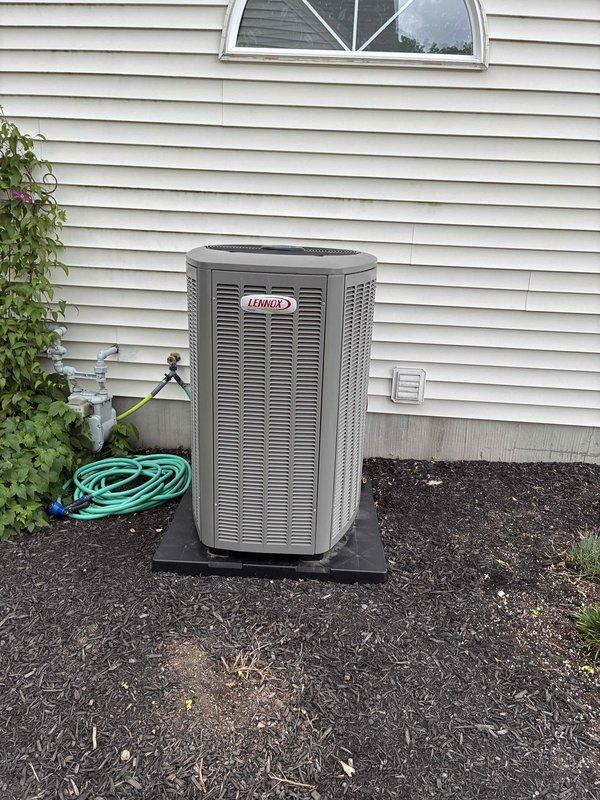 # HVAC Maintenance - Cooling

Performed comprehensive spring preventive maintenance on Lennox air conditioning system less than one year old. Inspected outdoor condenser unit positioned on rubber isolation pad, verified proper installation and clearances from structure. Checked electrical disconnect, refrigerant line connections, and condenser coil condition. Accessed indoor air handler, inspected blower motor assembly, verified all electrical connections and wire terminations secure. Examined control board operation, checked condensate drain system with visible PVC discharge piping, and confirmed all safety controls functioning properly. System operating within manufacturer specifications with no deficiencies noted.