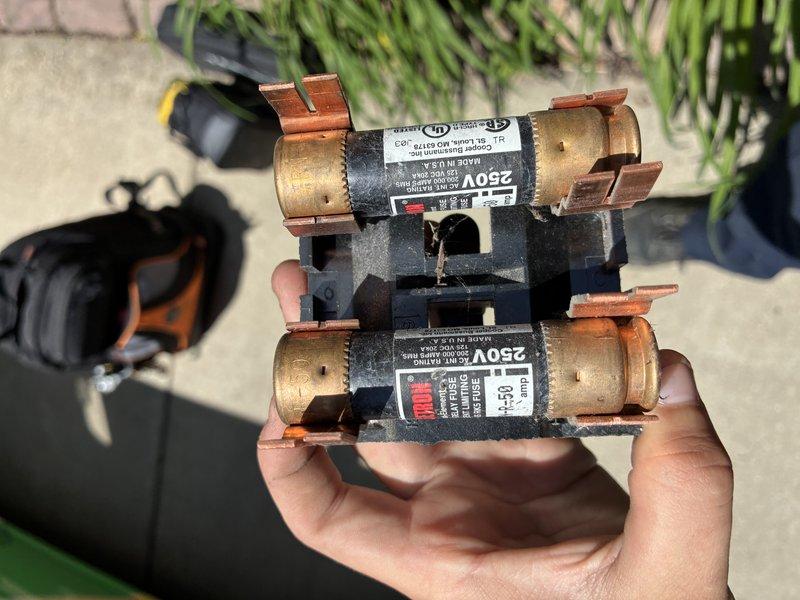 Responded to no cooling call and performed diagnostic evaluation of HVAC system. Upon inspection, discovered blown fuses in outdoor disconnect, preventing power to condensing unit. Observed extensive rust and corrosion on refrigerant lines at indoor blower assembly, indicating potential long-term moisture exposure issues. Replaced failed fuses to restore power to outdoor unit. System operational at time of departure, though customer advised of corroded copper lines that may require future attention to prevent refrigerant leaks.