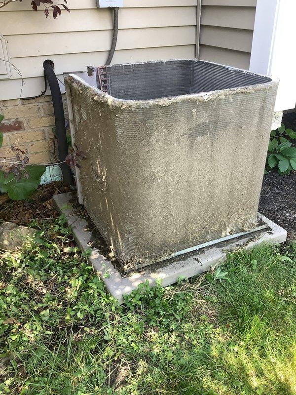 Responded to service call for central air conditioning system experiencing intermittent cooling and insufficient airflow from supply vents. Upon arrival, inspected outdoor condensing unit which showed signs of age with algae growth and surface deterioration on cabinet exterior. Evaluated indoor air distribution system and found supply register with accumulated dust and debris on louvers affecting airflow delivery. System was operational during inspection but exhibited reduced cooling capacity. Assessed unit performance and airflow characteristics to diagnose intermittent operation concerns reported over previous days.