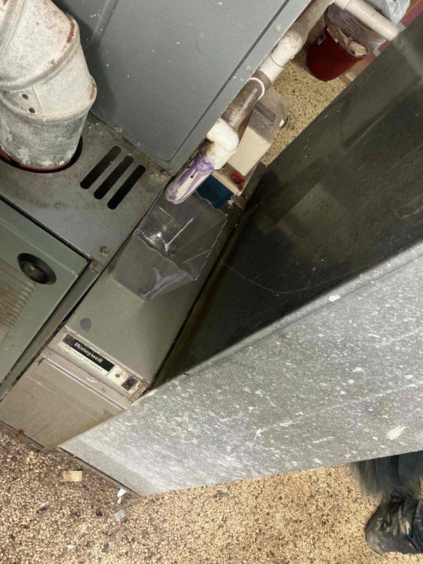 Conducted comprehensive evaluation of existing 20-year-old furnace and central air conditioning system for replacement estimate. Inspected current HVAC equipment installation including air handler unit, condensate drainage system with PVC piping, electrical connections, and associated mechanical components. Documented existing system configuration, photographed equipment condition showing age-related wear, and provided customer with detailed replacement options for complete heating and cooling system upgrade.
