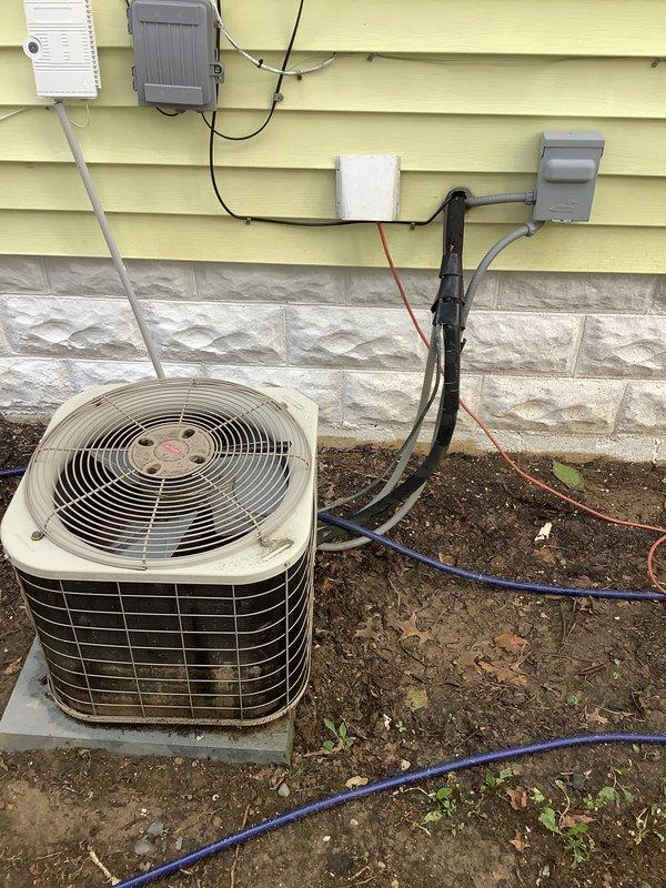 Completed full HVAC system installation including 80% efficiency furnace, air conditioning condenser unit, and hot water heater. The Bryant furnace was installed in the basement utility room with proper venting and ductwork connections, while the outdoor condenser unit was positioned on a concrete pad against the building exterior with appropriate electrical connections and conduit routing. All equipment was tested for proper operation, refrigerant lines were charged and sealed, and the system was commissioned to ensure optimal performance and efficiency.