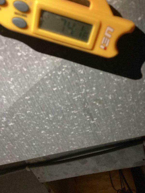 Returned to site with recovery tank to remove refrigerant from system. Documented temperature readings and observed heavy frost accumulation on evaporator coil, indicating refrigerant issue requiring recovery before repair work could proceed.