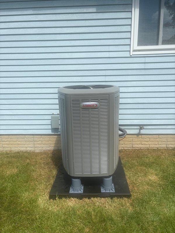 # HVAC Install - Complete System

Completed full system installation of Lennox heat pump with auxiliary heat strips. Installed outdoor condensing unit on composite pad against house exterior with proper clearances maintained. Unit positioned on level surface with adequate airflow access through louvered cabinet. Mounted electrical disconnect box on exterior siding with appropriate conduit routing to unit.

Inside air handler compartment, installed refrigerant line set connections with brass service valves on copper tubing. Applied insulation to suction line to prevent condensation. All refrigerant connections properly brazed and pressure tested. Heat strip assembly integrated into air handler for supplemental heating during low ambient temperatures. Verified all electrical connections secure and properly terminated. System startup completed with refrigerant charge verified to manufacturer specifications. Unit operating within normal parameters for heating and cooling modes.