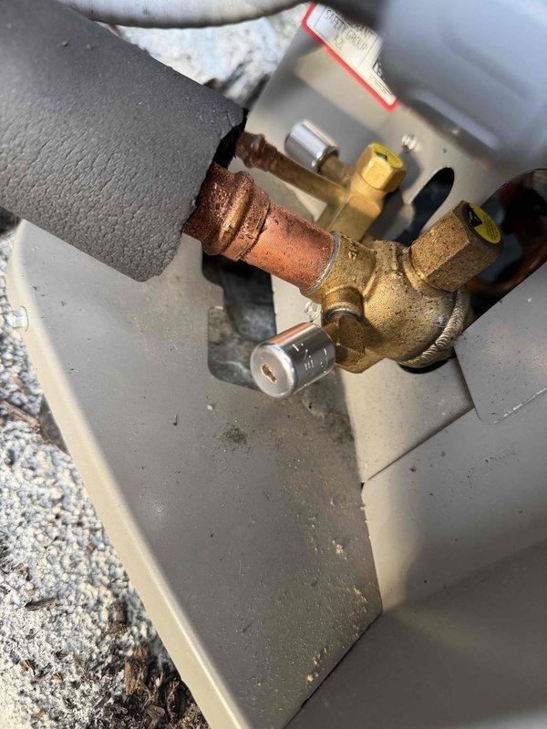 Completed installation of new Lennox air conditioning system with matching evaporator coil at residential property. Outdoor condensing unit was positioned on concrete pad against exterior foundation wall with proper clearance for airflow and serviceability. All refrigerant line sets, electrical connections, and condensate drainage were installed per manufacturer specifications. System was pressure tested, evacuated, and charged to factory requirements, then tested for proper operation and cooling performance.