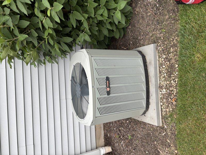 Completed scheduled MVP cooling maintenance visit on residential split system air conditioning unit. Performed comprehensive inspection of outdoor condenser unit and indoor evaporator coil assembly. Evaporator coil showed normal operational wear with minor dust accumulation between fins and slight oxidation marks at frame connections. Refrigerant lines and U-bend connections inspected and found secure with no visible leaks. Outdoor condenser unit operating properly on concrete pad with adequate clearance and airflow. Fan assembly and grille system functioning as designed.