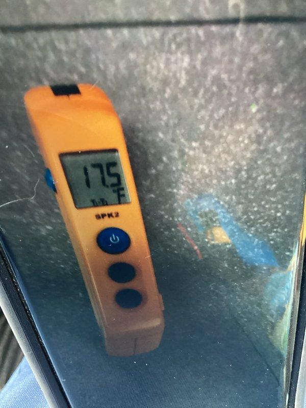 Responded to callback on recently installed AC system and evaporator coil not cooling properly. Upon arrival, confirmed thermostat would not reach setpoint below 78°F and unit was blowing warm air. Inspected basement installation and observed moisture on refrigerant line insulation. Performed diagnostic testing with digital measurement device, obtaining temperature readings to verify system performance. Checked thermostat wiring and control board connections to ensure proper installation and operation. System requires further evaluation to determine root cause of inadequate cooling and resolve moisture issue on refrigerant lines.