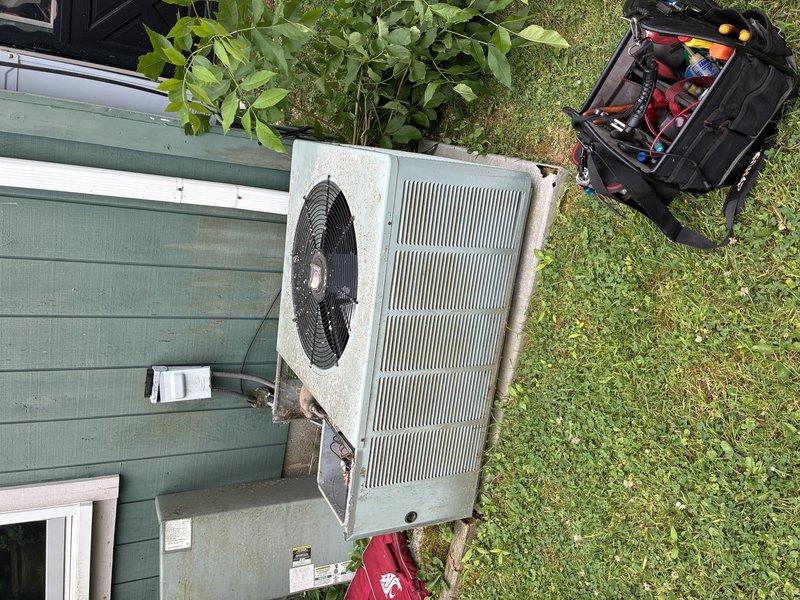 Responded to service call for air conditioning system not cooling adequately and water leakage at air handler. Upon arrival, performed comprehensive system diagnostic including refrigerant pressure testing and airflow evaluation of outdoor condensing unit. Inspected evaporator coil for proper drainage and identified source of water accumulation beneath furnace/air handler. Checked refrigerant line set connections and electrical components at outdoor unit. Verified system operation and cycling parameters to address extended run times and insufficient cooling capacity throughout home.