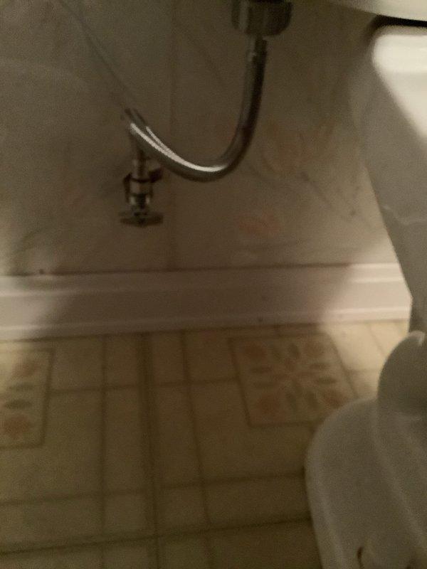 Removed pedestal sink to access leaking shutoff valves in basement bathroom, replaced shutoffs, compression nuts, and ferrules, then reinstalled pedestal sink with new faucet and pop-up drain assembly. At kitchen sink, addressed multiple drain leaks by cutting out and replacing all basket strainers and complete tubular drain assembly beneath sink.