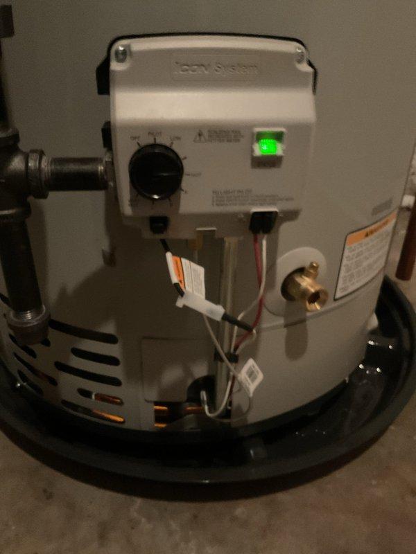 Replaced two existing water heaters with new Bradford White units: a 40-gallon tall model serving the master bath and laundry area, and a 50-gallon unit serving the remainder of the residence. Upgraded cold water shut-off valves on both units and eliminated the hot water shut-off valve on the 50-gallon unit. Installed expansion tanks on both water heaters with proper bonding wire connections. Rebuilt corroded hot and cold water copper lines above the 40-gallon unit from the heater to ceiling-mounted swing joint 90-degree fittings, removing green corrosion-damaged piping. Eliminated the humidifier supply valve during the replumb. Installed drain pan beneath the 40-gallon water heater with discharge line routed to existing sump pump for overflow protection. All installations completed per manufacturer specifications with proper venting and code-compliant connections.