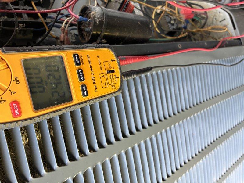 Completed scheduled preventive maintenance cooling inspection on 13-year-old HVAC system. Performed comprehensive electrical diagnostics using digital multimeter to test capacitor, evaporator coil circuits, and system components. All measurements verified within acceptable operating parameters, system operating efficiently with no deficiencies noted.