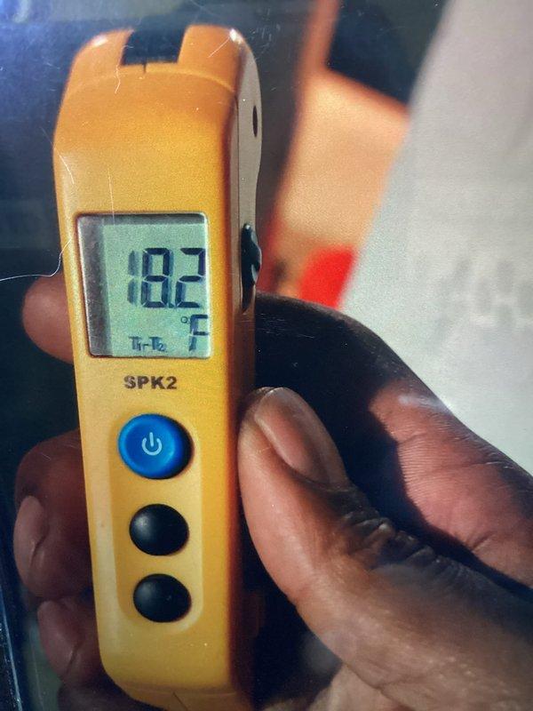 Responded to no cooling complaint on seven-year-old air conditioning system. Upon inspection, discovered evaporator coil heavily contaminated with dust, debris, and biological growth causing severely restricted airflow and reduced heat transfer efficiency. Temperature differential measurement confirmed inadequate cooling performance at 18.2°F. Documented coil condition with photos showing significant buildup particularly concentrated in upper sections of fin assembly, with visible mold and particulate matter throughout. Advised customer of findings and recommended thorough coil cleaning or replacement to restore proper system operation and cooling capacity.