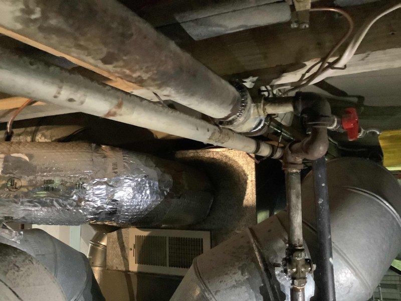 Responded to a gas leak call at the property. Upon arrival, confirmed the presence of a gas leak and conducted a thorough inspection of the gas system infrastructure. Investigation revealed that the leak was isolated to specific equipment within the mechanical space. During the assessment, discovered that the gas utility company had already shut off the gas supply to the property as a safety precaution. Inspected the overhead plumbing and gas piping assembly, including copper lines, black iron pipe, shutoff valves, and associated fittings in the basement mechanical area. Documented the existing gas line configuration and equipment connections with photographs for record-keeping purposes. Enrolled the property in the maintenance value program as part of establishing service for the new residence.