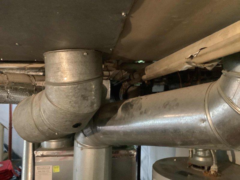 Responded to a gas leak call at the property. Upon arrival, confirmed the presence of a gas leak and conducted a thorough inspection of the gas system infrastructure. Investigation revealed that the leak was isolated to specific equipment within the mechanical space. During the assessment, discovered that the gas utility company had already shut off the gas supply to the property as a safety precaution. Inspected the overhead plumbing and gas piping assembly, including copper lines, black iron pipe, shutoff valves, and associated fittings in the basement mechanical area. Documented the existing gas line configuration and equipment connections with photographs for record-keeping purposes. Enrolled the property in the maintenance value program as part of establishing service for the new residence.