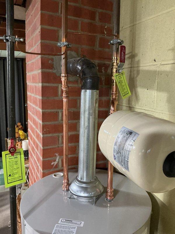 Installed a new 40-gallon short Bradford White water heater with 6-year manufacturer warranty. Installation included a new ball valve, gas shut-off valve, and thermal expansion tank. All components were professionally connected with copper piping, brass fittings, and proper support brackets. The unit was properly vented with galvanized flue piping and secured according to code requirements. System was tested and verified operational upon completion.