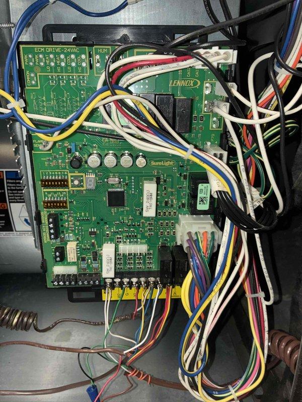 Completed MVP cooling maintenance tune-up on two residential HVAC units (5-year-old and 11-year-old systems, both outdoor installations). Performed comprehensive inspection of Lennox control board and SureLight circuit board assembly, verified all electrical connections and relay switches, checked evaporator coil and filter condition, and inspected refrigerant lines and drainage components to ensure optimal system performance for the cooling season.