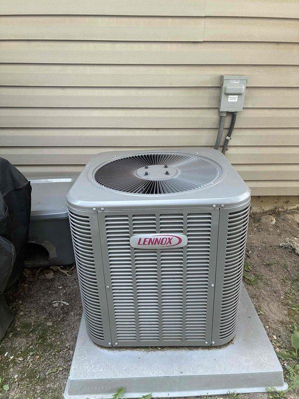 Completed first-time maintenance visit on an 8-year-old Lennox air conditioning system for MVP customer. Performed standard cooling season inspection of outdoor condensing unit, which showed normal accumulation of dirt, dust, and debris on condenser coils and surrounding concrete pad. Unit operational with refrigerant lines and electrical disconnect properly installed and functioning.