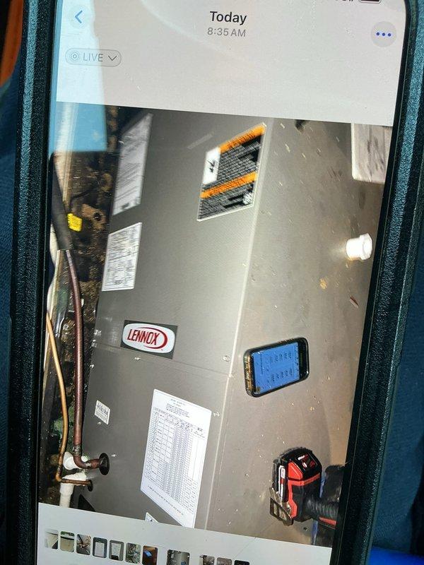 Responded to no cooling complaint on Lennox HVAC system. Performed diagnostic testing in attic space using electronic measuring instruments to assess system operation and refrigerant levels. Inspected ductwork and air handler components, noting dust accumulation on flexible duct system and surrounding areas. Evaluated unit specifications and operational parameters to identify cause of complete system failure and restore cooling functionality.
