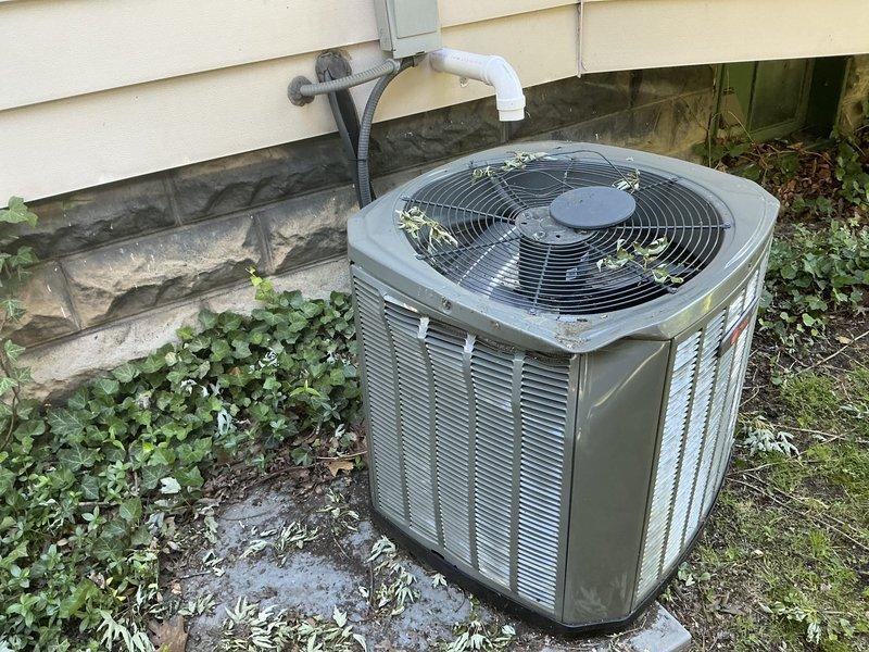 Completed estimate for air conditioning system replacement after unit sustained damage from fallen tree branches. Exterior condensing unit on concrete pad and interior ductwork in attic space were assessed and photographed to document existing conditions and determine full scope of replacement requirements.