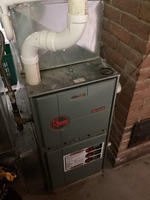 Responded to follow-up service call for 22-day-old air conditioning system experiencing freezing issues after previous no-cooling complaint. Upon arrival, confirmed unit had thawed out and was operational for diagnostic testing. Measured suction line temperature at 33.14°F, indicating potential low refrigerant charge or restricted airflow causing evaporator coil to freeze. Inspected Rheem 80 PLUS furnace/air handler system and documented equipment condition. Performed system evaluation to identify root cause of freezing condition and prevent recurrence.