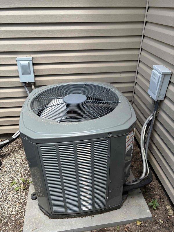 Completed preventive maintenance cooling visit on 13-year-old residential air conditioning system. Performed comprehensive inspection of outdoor condenser unit, verified proper operation of fan motor and protective grille assembly, and assessed condenser coil condition. Unit found operating within normal parameters with some age-appropriate discoloration noted on coil fins. All electrical connections secure and system functioning as designed.