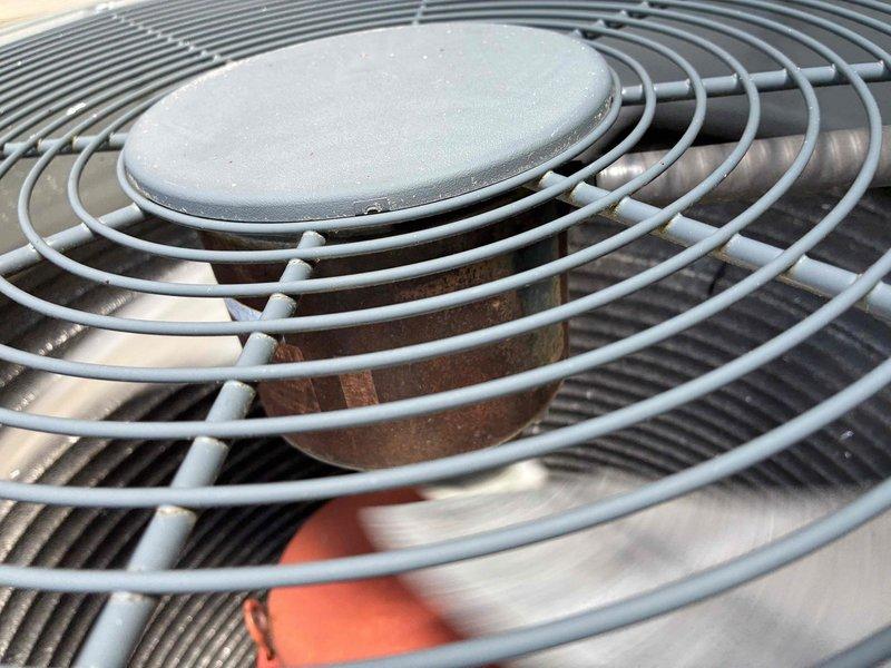 Completed preventive maintenance cooling visit on 13-year-old residential air conditioning system. Performed comprehensive inspection of outdoor condenser unit, verified proper operation of fan motor and protective grille assembly, and assessed condenser coil condition. Unit found operating within normal parameters with some age-appropriate discoloration noted on coil fins. All electrical connections secure and system functioning as designed.