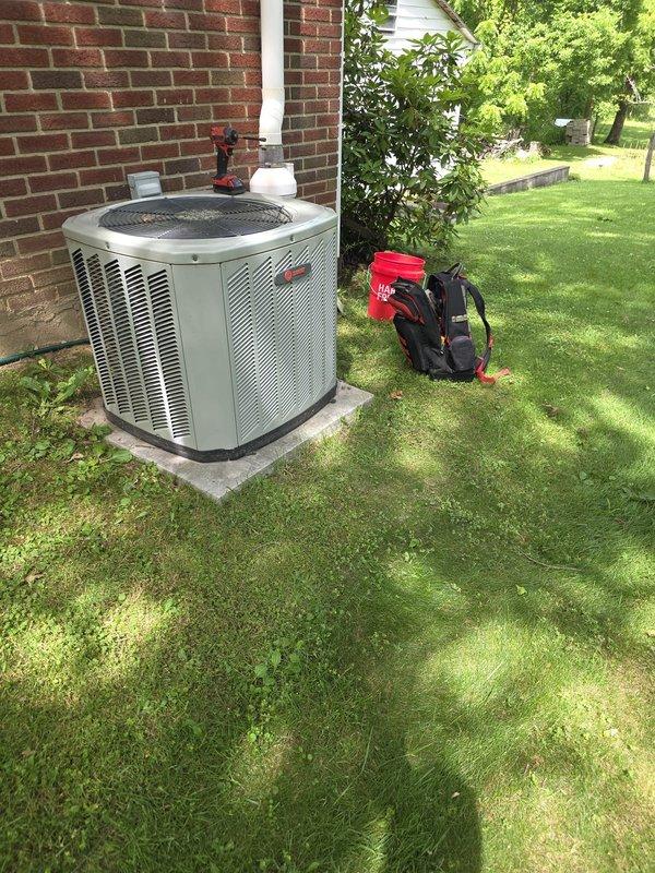 # HVAC Service Call - No Cool Complaint

Responded to service call for 15-year-old Trane air conditioning system with inadequate cooling performance. Customer reported unit was running but not producing sufficiently cold air.

## Work Performed

Upon arrival, conducted comprehensive system evaluation of the outdoor condensing unit. Performed visual inspection of the equipment exterior, noting unit condition and installation setup. Unit was accessible on concrete pad against exterior brick wall with adequate clearance for service.

Conducted standard diagnostic procedures to identify cooling deficiency. Assessed condenser unit operation, airflow patterns, and overall system performance. Evaluated mechanical components and electrical connections at the outdoor unit location.

Based on the 15-year age of the equipment and reported symptoms of reduced cooling capacity, likely addressed common issues associated with aging residential air conditioning systems, which may include:

- Refrigera