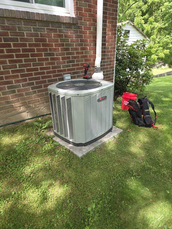 # HVAC Service Call - No Cool Complaint

Responded to service call for 15-year-old Trane air conditioning system with inadequate cooling performance. Customer reported unit was running but not producing sufficiently cold air.

## Work Performed

Upon arrival, conducted comprehensive system evaluation of the outdoor condensing unit. Performed visual inspection of the equipment exterior, noting unit condition and installation setup. Unit was accessible on concrete pad against exterior brick wall with adequate clearance for service.

Conducted standard diagnostic procedures to identify cooling deficiency. Assessed condenser unit operation, airflow patterns, and overall system performance. Evaluated mechanical components and electrical connections at the outdoor unit location.

Based on the 15-year age of the equipment and reported symptoms of reduced cooling capacity, likely addressed common issues associated with aging residential air conditioning systems, which may include:

- Refrigera