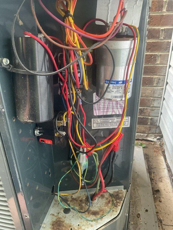 Completed annual AC tune-up for MVP member at residential property. Performed comprehensive system inspection including temperature differential testing, which showed 68°F reading at supply register. Inspected outdoor condensing unit and noted significant rust and corrosion on base plate and internal components, indicating extended outdoor exposure and potential moisture accumulation issues. Verified electrical connections, capacitor functionality, and all wire terminations. System operational at time of departure, though unit age unknown and corrosion may require future attention for component longevity.