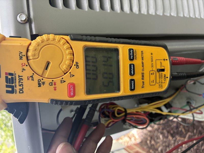 Completed preventive maintenance tune-up on 20+ year old air conditioning system covered under MVP contract. Performed comprehensive system inspection and testing using digital multimeter to verify electrical readings and system performance parameters. All measurements recorded at 23.75 on clamp meter during operational testing, indicating proper amperage draw within manufacturer specifications for aging equipment.